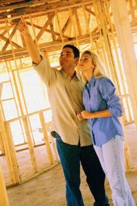 young couple in new home construction